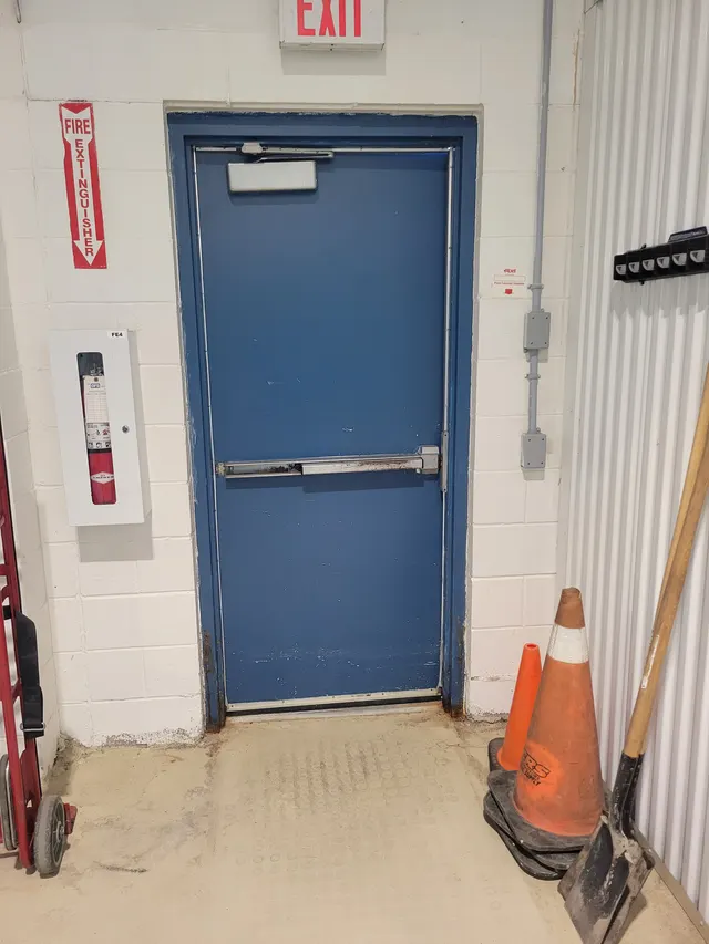 The same door at Progress Drive before Access Installs replaced it