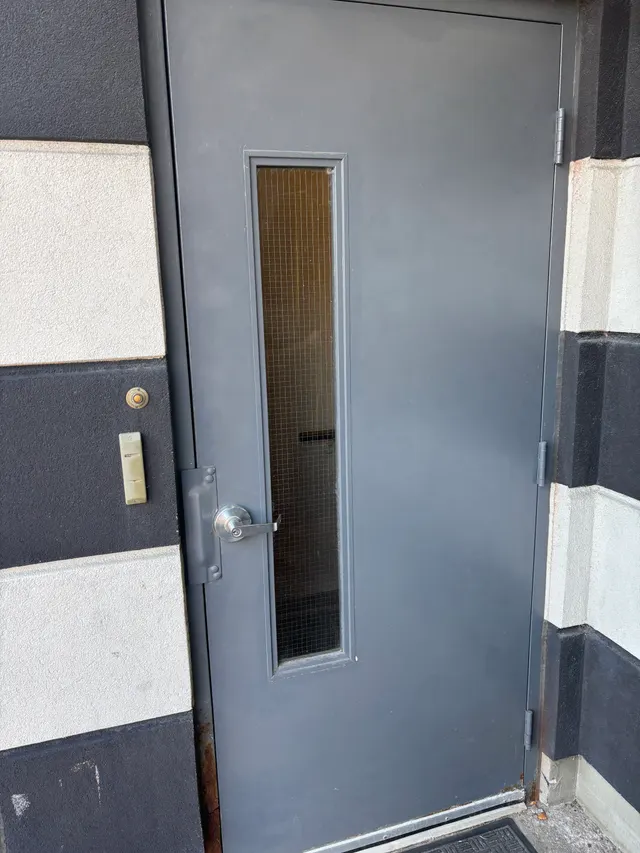 The same door at Whittle before Access Installs replaced it